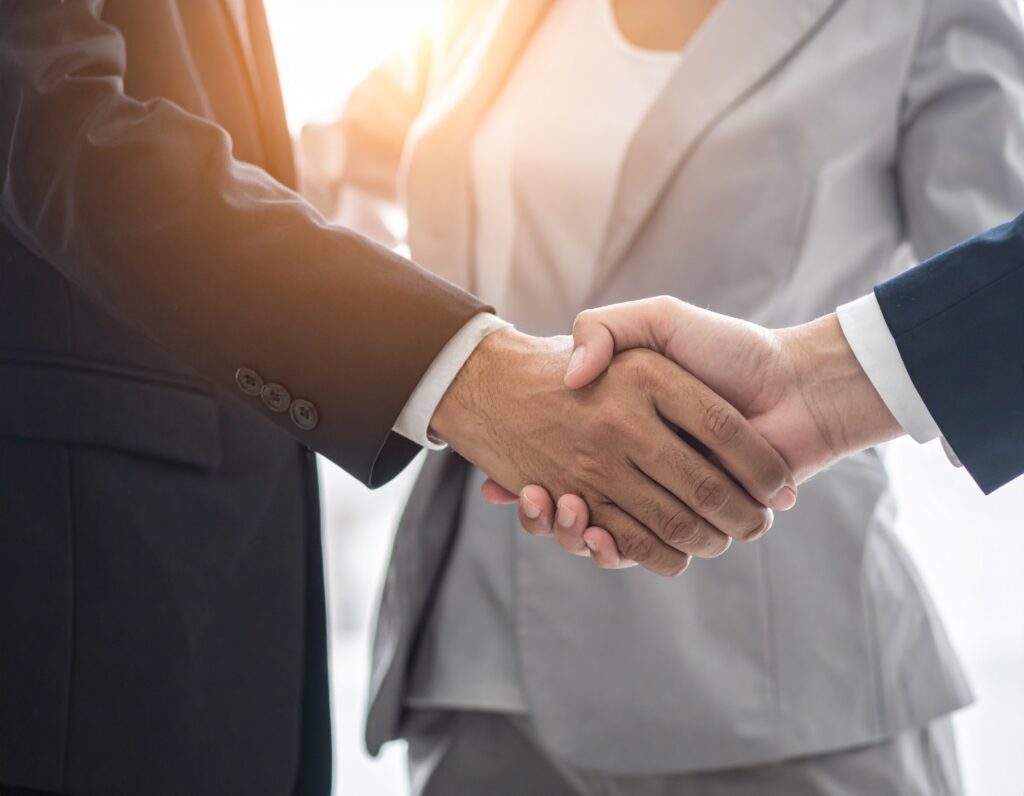 Business people shaking hands.