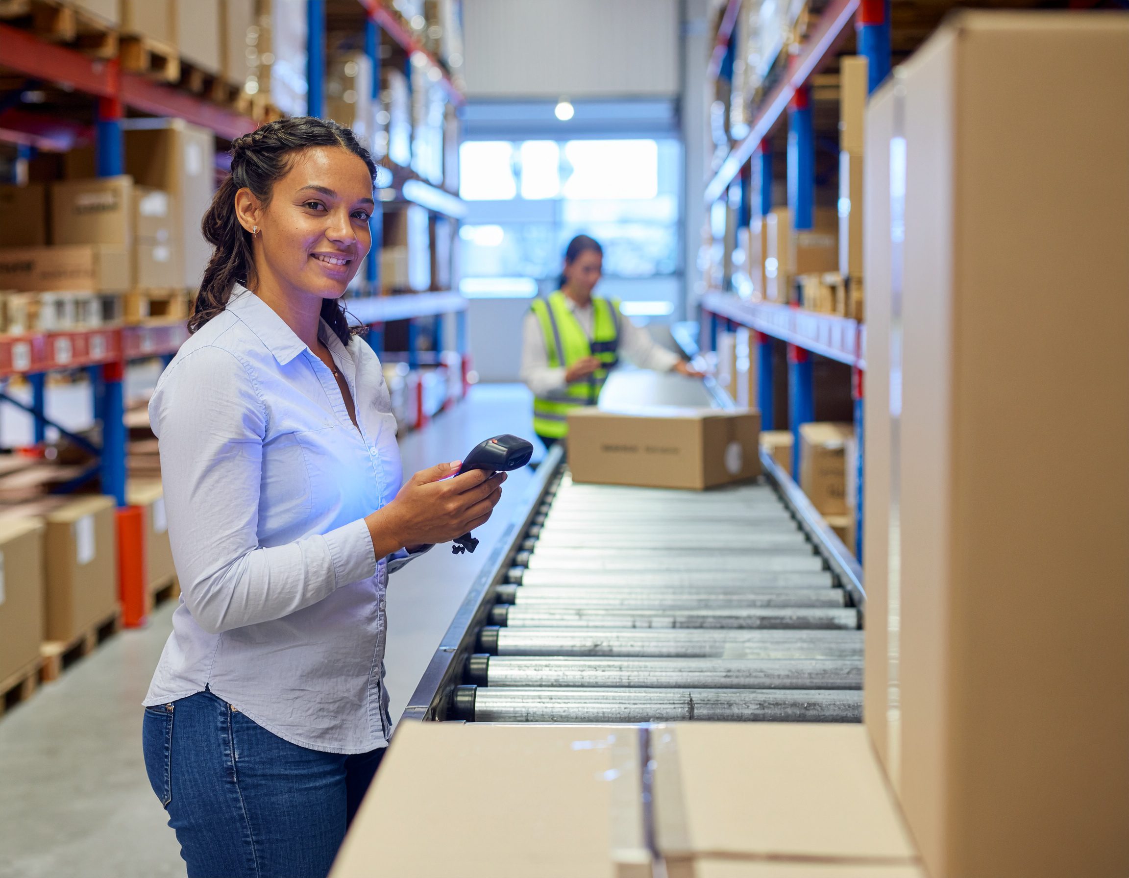 Warehouse worker scanning packages - Logistics Buyer
